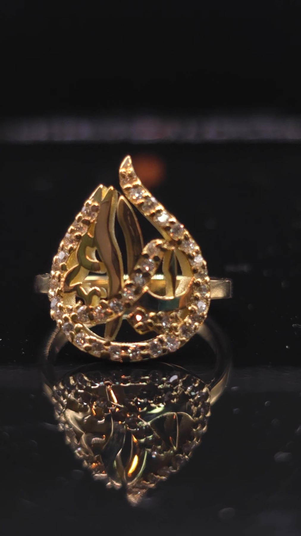 Custom gold ring featuring Arabic calligraphy set with diamonds